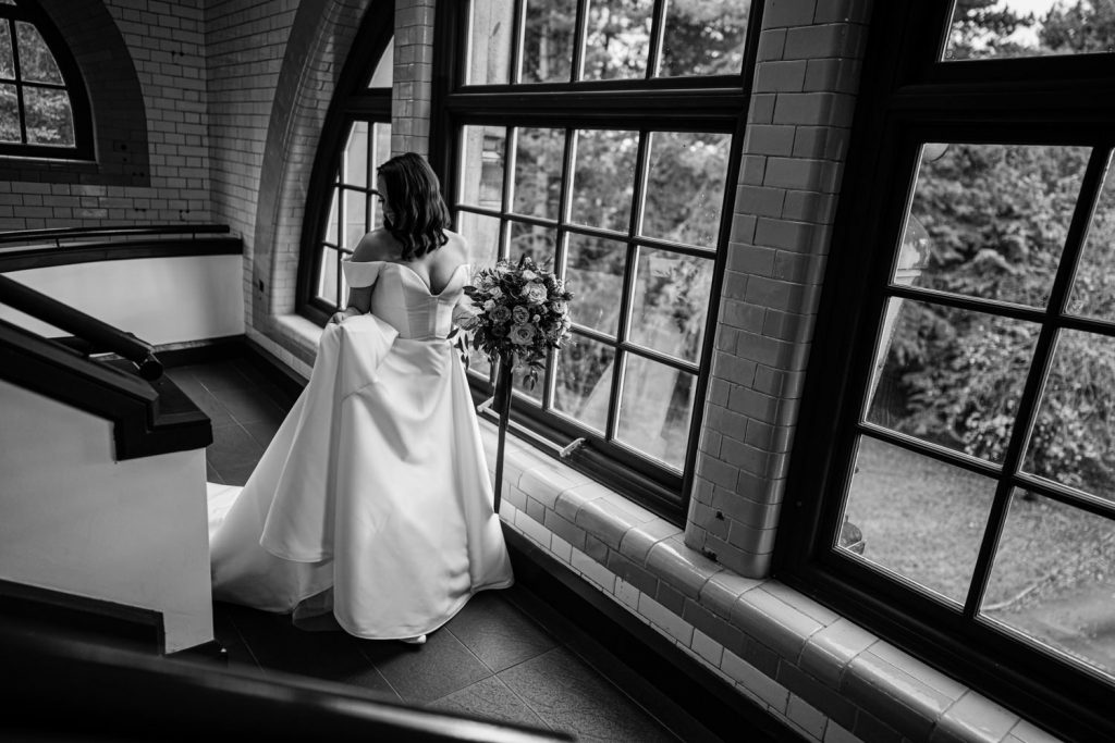 A black and white photograph of Parisa on her wedding day at The Pumping House Ollerton 
